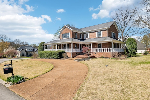 1001 Williams Way, Old Hickory, TN 37138 - view of front facade featuring brick siding, covered porch, a front yard, and curved driveway