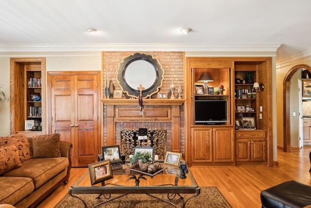 1001 Williams Way, Old Hickory, TN 37138 - living room with ornamental molding, light wood finished floors, arched walkways, built in features, and baseboards