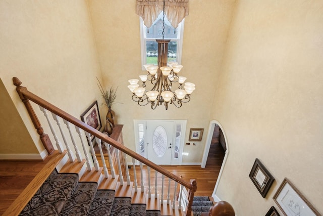 1001 Williams Way, Old Hickory, TN 37138 - staircase with a towering ceiling, wood finished floors, arched walkways, a chandelier, and baseboards