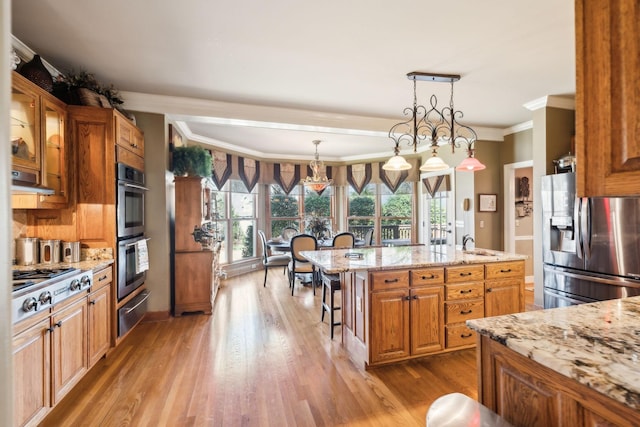 1001 Williams Way, Old Hickory, TN 37138 - kitchen with stainless steel appliances, ornamental molding, a kitchen bar, a warming drawer, and light stone counters
