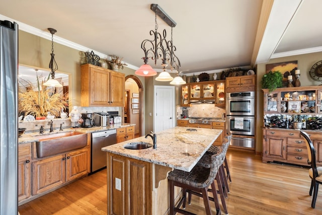 1001 Williams Way, Old Hickory, TN 37138 - kitchen featuring appliances with stainless steel finishes, a sink, a warming drawer, decorative backsplash, and an island with sink