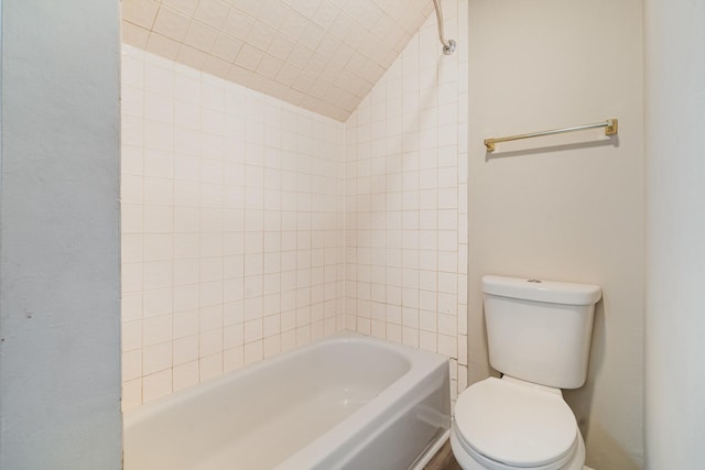full bath featuring toilet and lofted ceiling