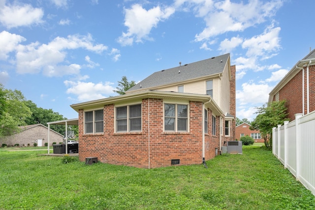 back of property with brick siding and cooling unit