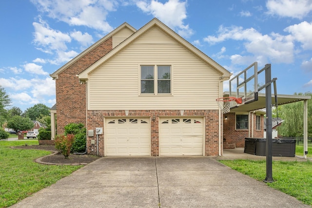 view of front of house featuring a hot tub, a garage, concrete driveway, and brick siding