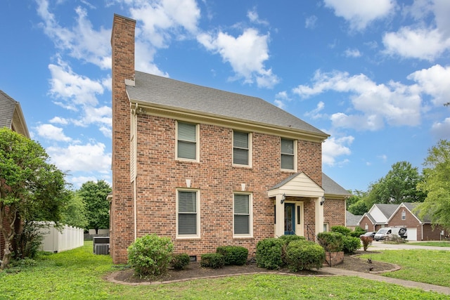 view of front of house with a chimney, brick siding, and roof with shingles
