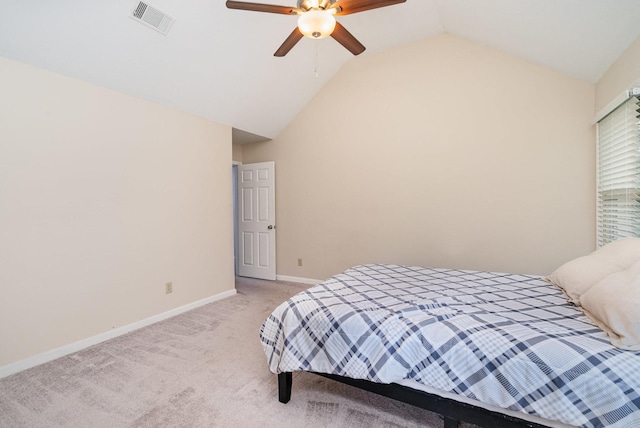 bedroom featuring light carpet, lofted ceiling, baseboards, and ceiling fan