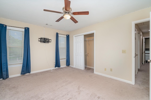 unfurnished bedroom featuring carpet floors and baseboards
