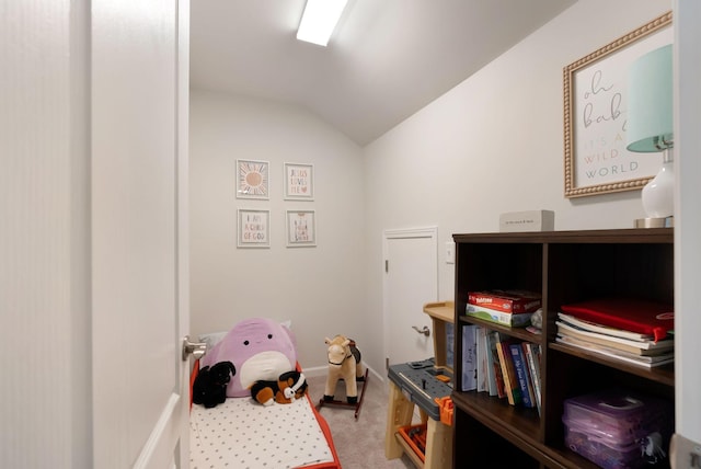 rec room featuring vaulted ceiling and carpet