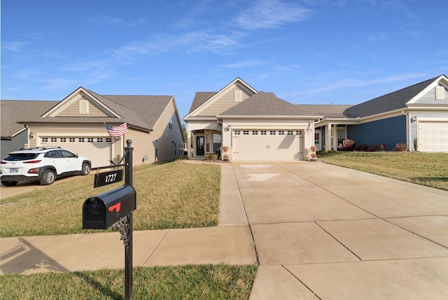 single story home featuring a front yard, an attached garage, and driveway