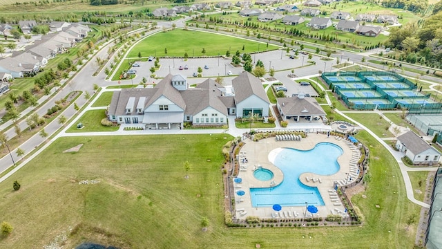 aerial view of residential area featuring a pool area