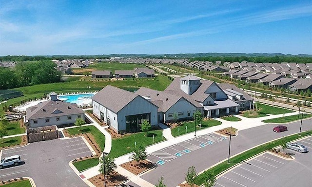 aerial view of residential area featuring a pool