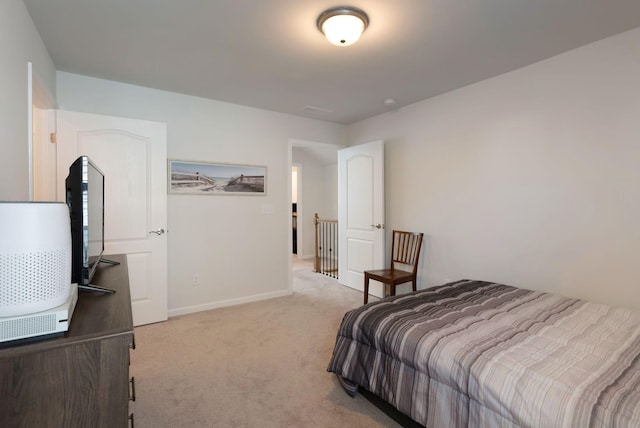 bedroom with carpet and baseboards