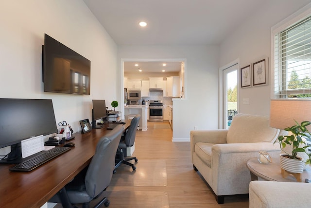 office area with light wood-style flooring and recessed lighting