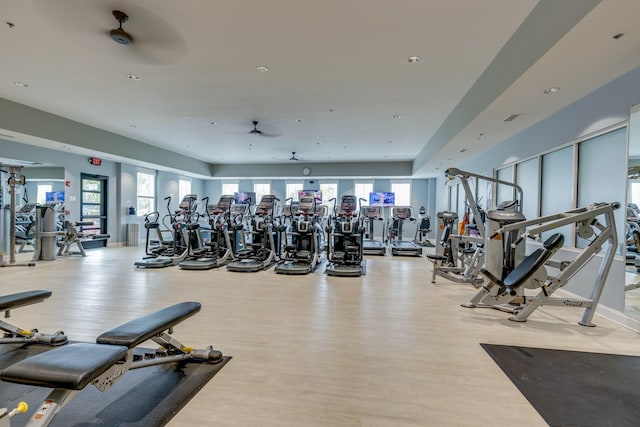 workout area featuring plenty of natural light, ceiling fan, light wood-type flooring, and recessed lighting