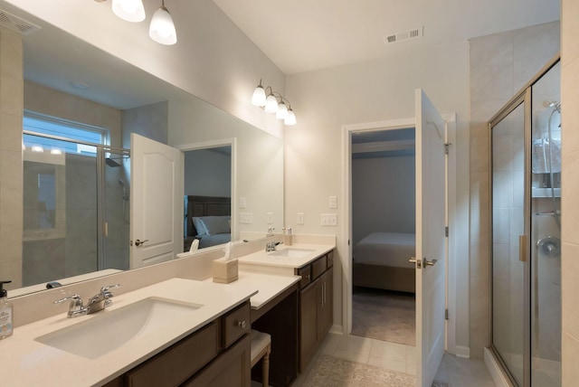 bathroom with ensuite bath, a stall shower, tile patterned flooring, and double vanity