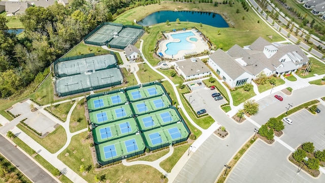 bird's eye view of a nearby body of water and a pool