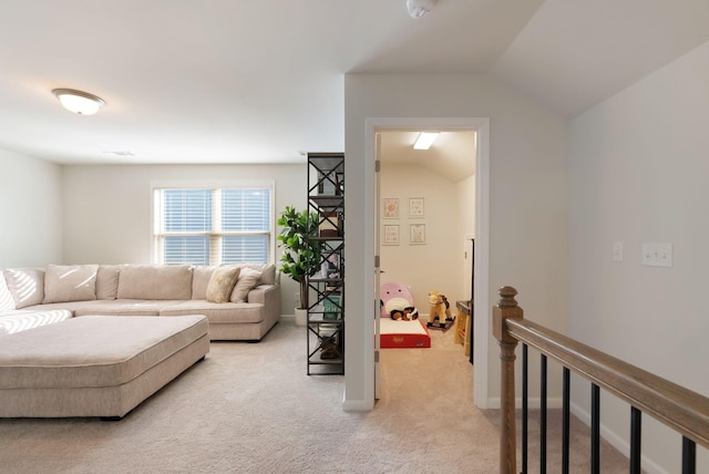 living area with light colored carpet and lofted ceiling