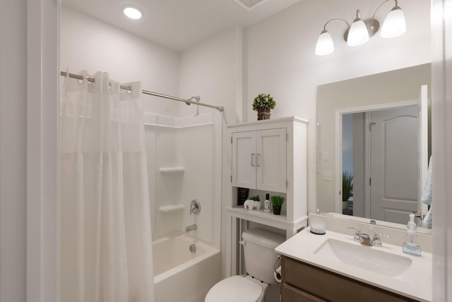bathroom with toilet, vanity, shower / tub combo with curtain, and recessed lighting