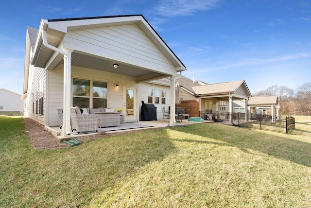 back of house with an outdoor hangout area and a patio