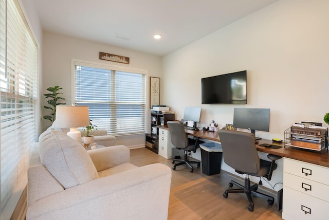 office with wood finished floors, plenty of natural light, and recessed lighting