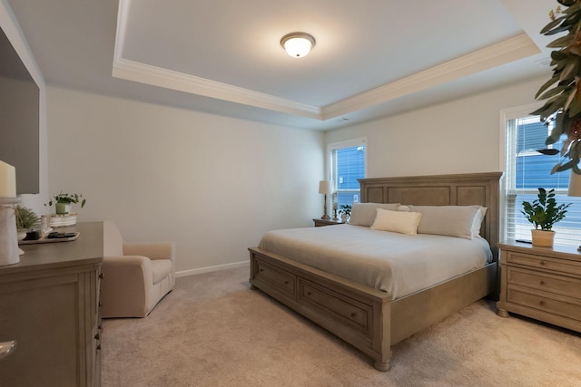 bedroom featuring a raised ceiling, ornamental molding, light colored carpet, and multiple windows