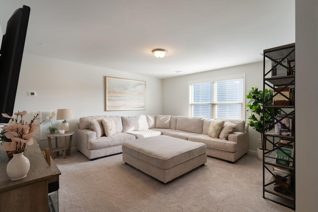 living room featuring light carpet