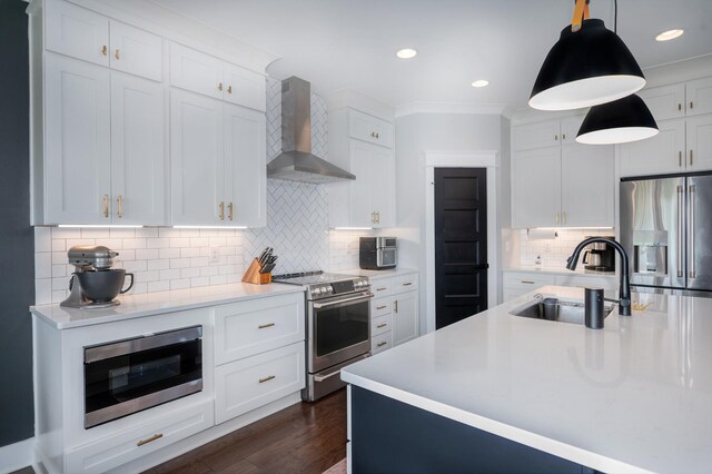 144 Autumn Crk, Lebanon, TN 37087 - kitchen with stainless steel appliances, wall chimney range hood, a sink, light countertops, and recessed lighting