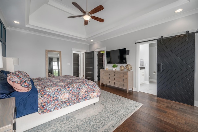 144 Autumn Crk, Lebanon, TN 37087 - bedroom featuring a walk in closet, a barn door, dark wood-style floors, a raised ceiling, and recessed lighting