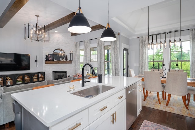 144 Autumn Crk, Lebanon, TN 37087 - kitchen featuring stainless steel dishwasher, a sink, open floor plan, dark wood-type flooring, and healthy amount of natural light