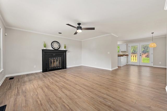 1643 Windy Meadow Dr, Christiana, TN 37037 - unfurnished living room featuring a fireplace with flush hearth, a ceiling fan, light wood finished floors, baseboards, and ornamental molding