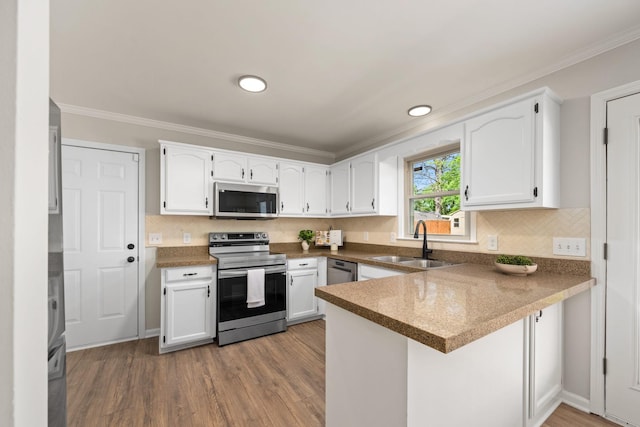 1643 Windy Meadow Dr, Christiana, TN 37037 - kitchen featuring stainless steel appliances, a sink, a peninsula, white cabinetry, and tasteful backsplash
