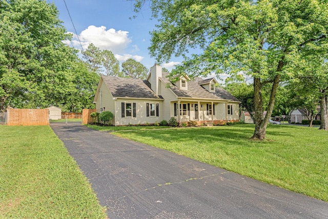 1643 Windy Meadow Dr, Christiana, TN 37037 - new england style home featuring a porch, a chimney, a shingled roof, and an outdoor structure
