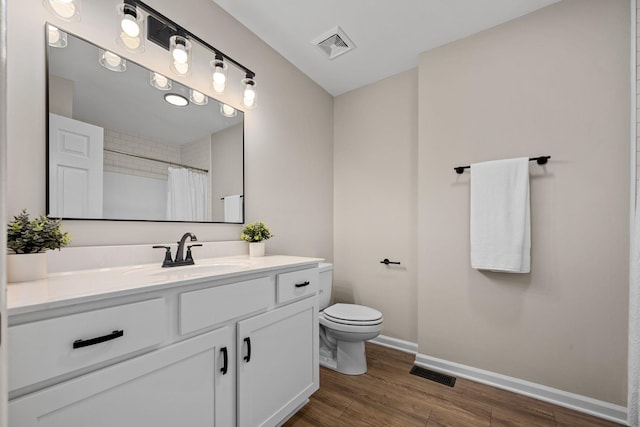1643 Windy Meadow Dr, Christiana, TN 37037 - bathroom with toilet, wood finished floors, baseboards, vanity, and a shower with shower curtain