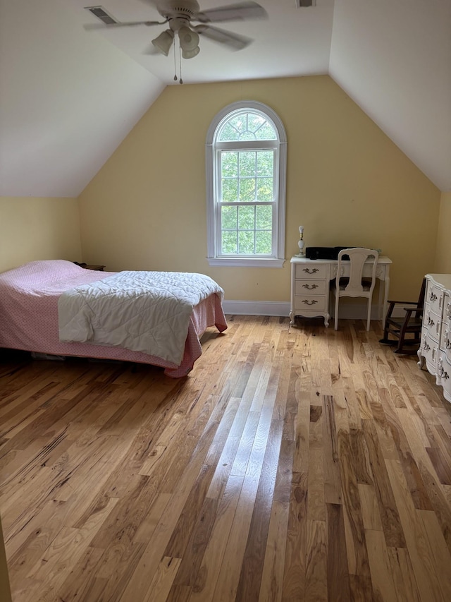 204 Revilo Rd, Leoma, TN 38468 - bedroom with light wood-style flooring, lofted ceiling, a ceiling fan, and baseboards