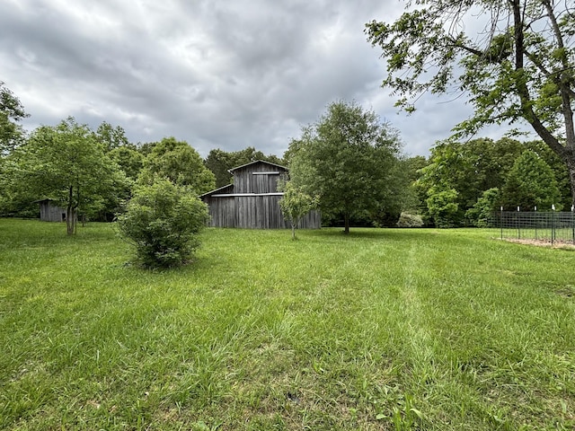 204 Revilo Rd, Leoma, TN 38468 - view of yard with an outdoor structure and a barn