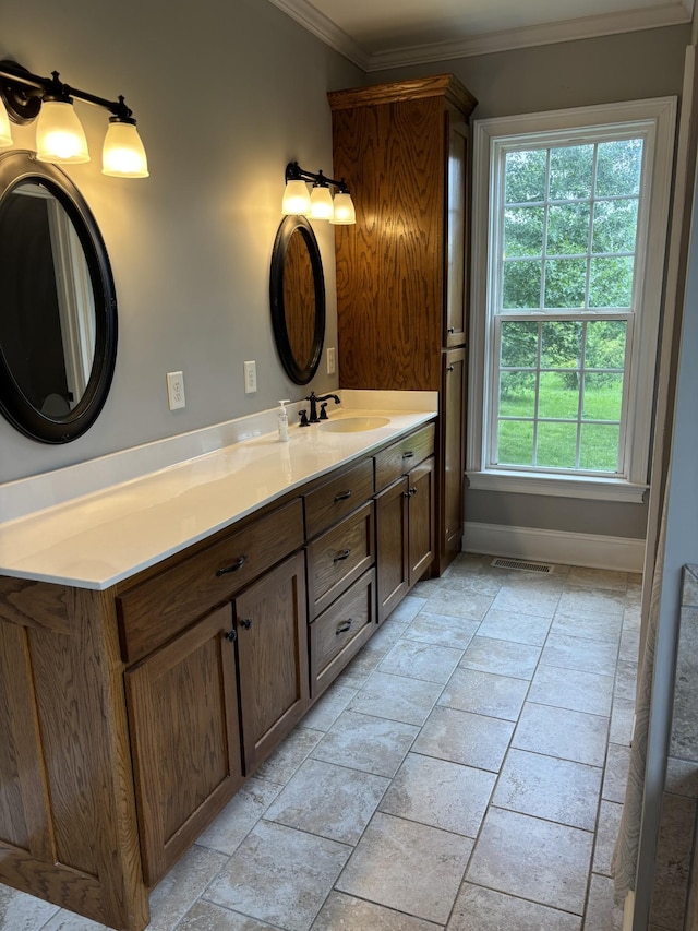 204 Revilo Rd, Leoma, TN 38468 - bathroom with ornamental molding, healthy amount of natural light, stone tile floors, and vanity