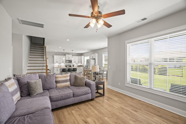1112 Malinda Ln, Greenbrier, TN 37073 - living area with a ceiling fan, light wood-style flooring, stairs, baseboards, and recessed lighting