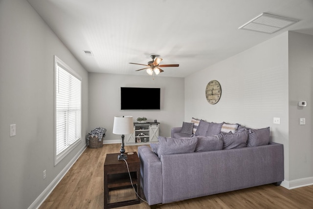 1112 Malinda Ln, Greenbrier, TN 37073 - living area featuring ceiling fan, wood finished floors, plenty of natural light, and baseboards