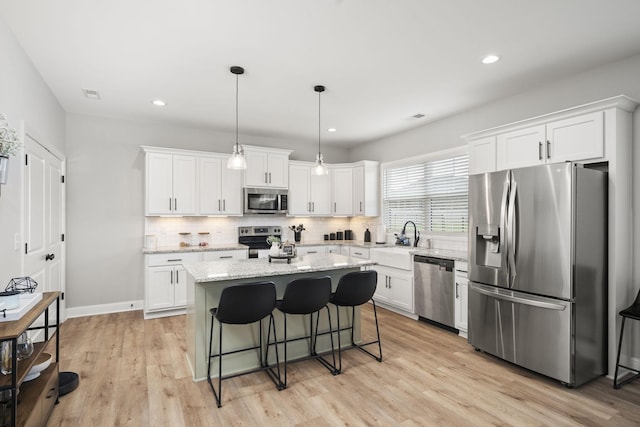 1112 Malinda Ln, Greenbrier, TN 37073 - kitchen featuring stainless steel appliances, a sink, white cabinetry, tasteful backsplash, and recessed lighting