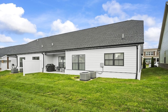 1112 Malinda Ln, Greenbrier, TN 37073 - back of house featuring a patio area, central AC unit, a shingled roof, and a lawn