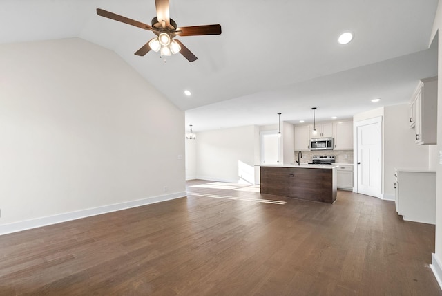 1936 Flats Rd, Cunningham, TN 37052 - unfurnished living room with a ceiling fan, recessed lighting, vaulted ceiling, a sink, and dark wood-style floors