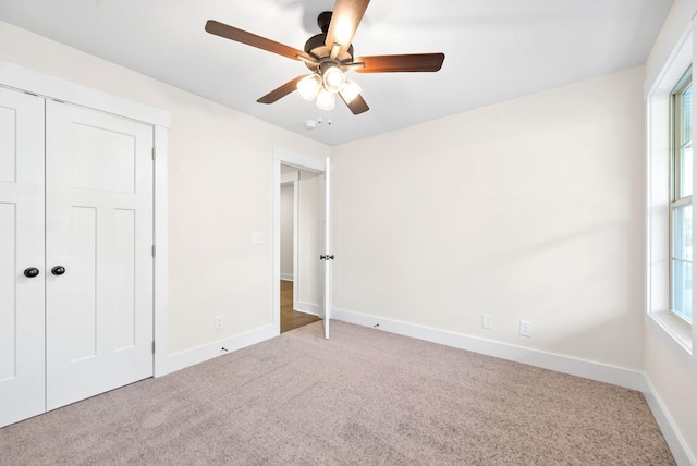 1936 Flats Rd, Cunningham, TN 37052 - unfurnished bedroom with carpet flooring, baseboards, a ceiling fan, and a closet
