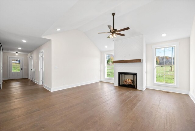 1936 Flats Rd, Cunningham, TN 37052 - unfurnished living room with dark wood-style floors, a fireplace, a ceiling fan, baseboards, and lofted ceiling