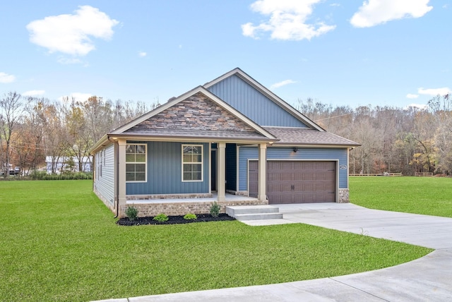 1936 Flats Rd, Cunningham, TN 37052 - view of front of home featuring covered porch, driveway, a garage, and a front lawn