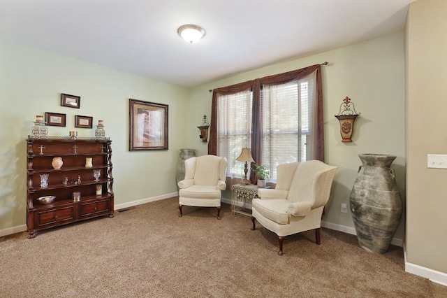 sitting room with carpet flooring and baseboards