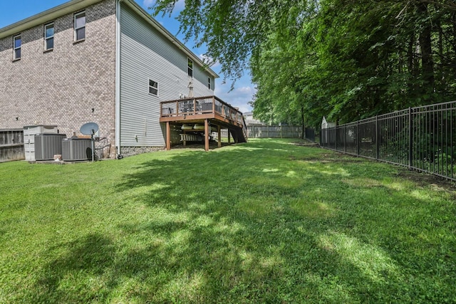 view of yard featuring a wooden deck and cooling unit
