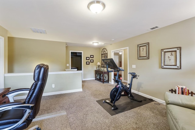 workout area featuring carpet flooring and baseboards