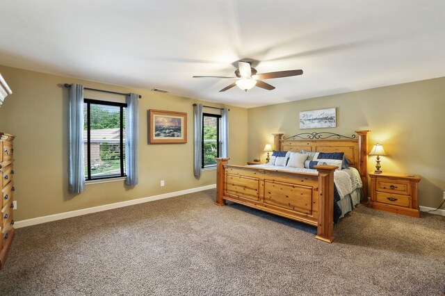 bedroom with light carpet, baseboards, and a ceiling fan