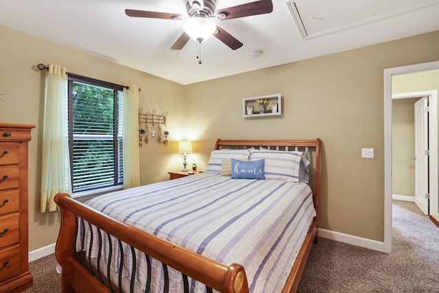 carpeted bedroom featuring attic access, baseboards, and ceiling fan