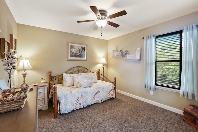 bedroom with carpet flooring, baseboards, and ceiling fan